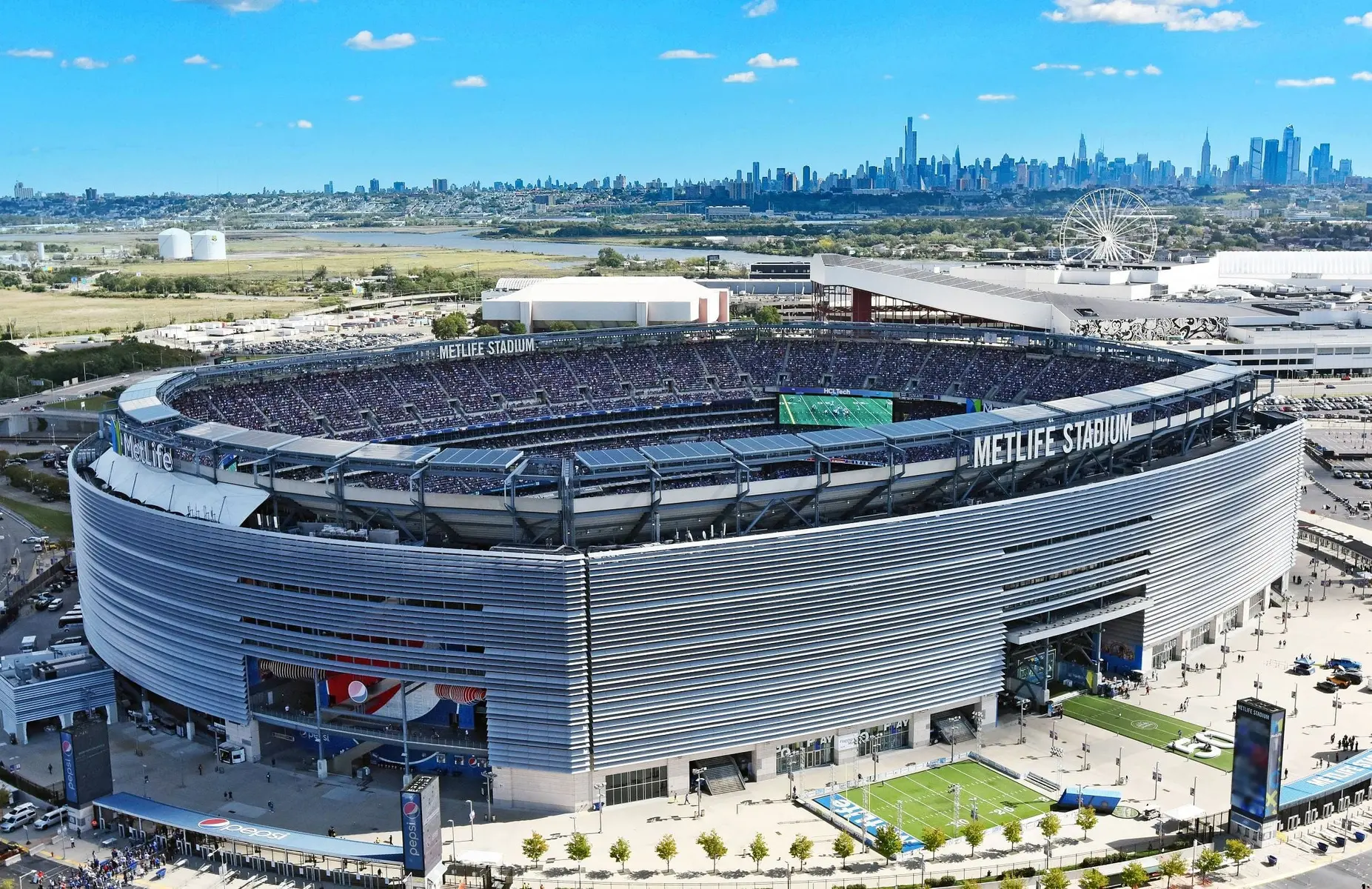Aerial view of MetLife Stadium with a clear skyline in the background.
