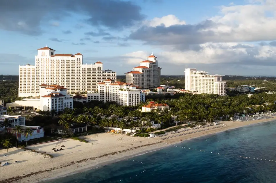Aerial view of the WSOP Paradise Bahamas resort along the beach.