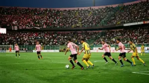 Palermo players in pink face Juve Stabia during a tense football match at Stadio Renzo Barbera